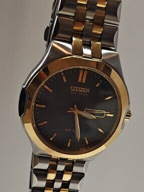 Citizen Eco-Drive Two-Tone Watch with Black Dial and Gold Accents